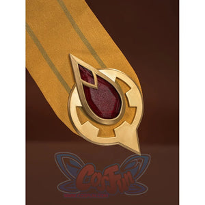 Sandrone cosplay costume skirt panel tip closeup showing circular gold mount with downward arrow and large red teardrop gem
