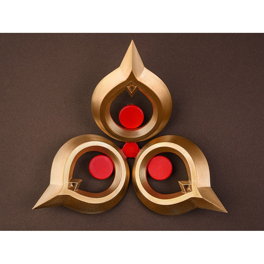 Sandrone cosplay costume waist ornament accessory laid flat, gold piece with three red gem circles in teardrop frames
