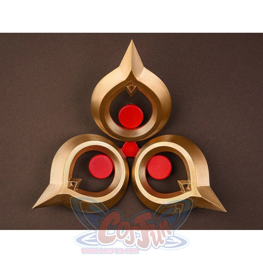 Sandrone cosplay costume waist ornament accessory laid flat, gold piece with three red gem circles in teardrop frames