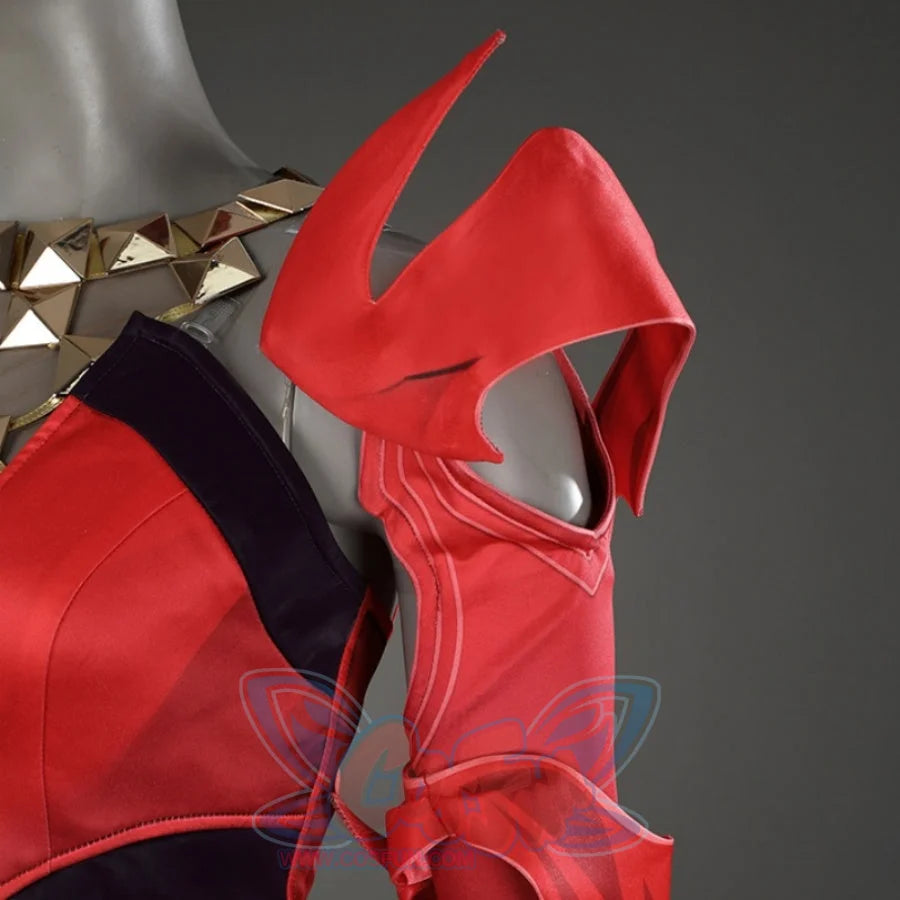 Close-up of Scarlet Witch cosplay costume’s shoulder, highlighting the red, angular shoulder armor and gold-studded neckline.