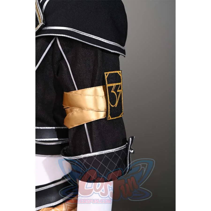 A close-up of the armband on Sciel's cosplay costume, revealing the gold emblem and the detailed design on the black fabric.