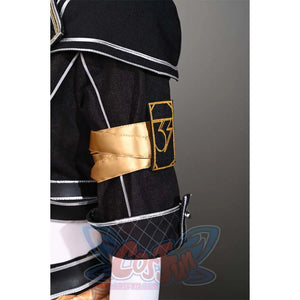 A close-up of the armband on Sciel's cosplay costume, revealing the gold emblem and the detailed design on the black fabric.