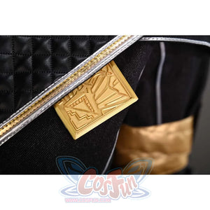 This close-up shows the badge on Sciel's cosplay costume, which is a gold geometric design adding a unique touch to the outfit.