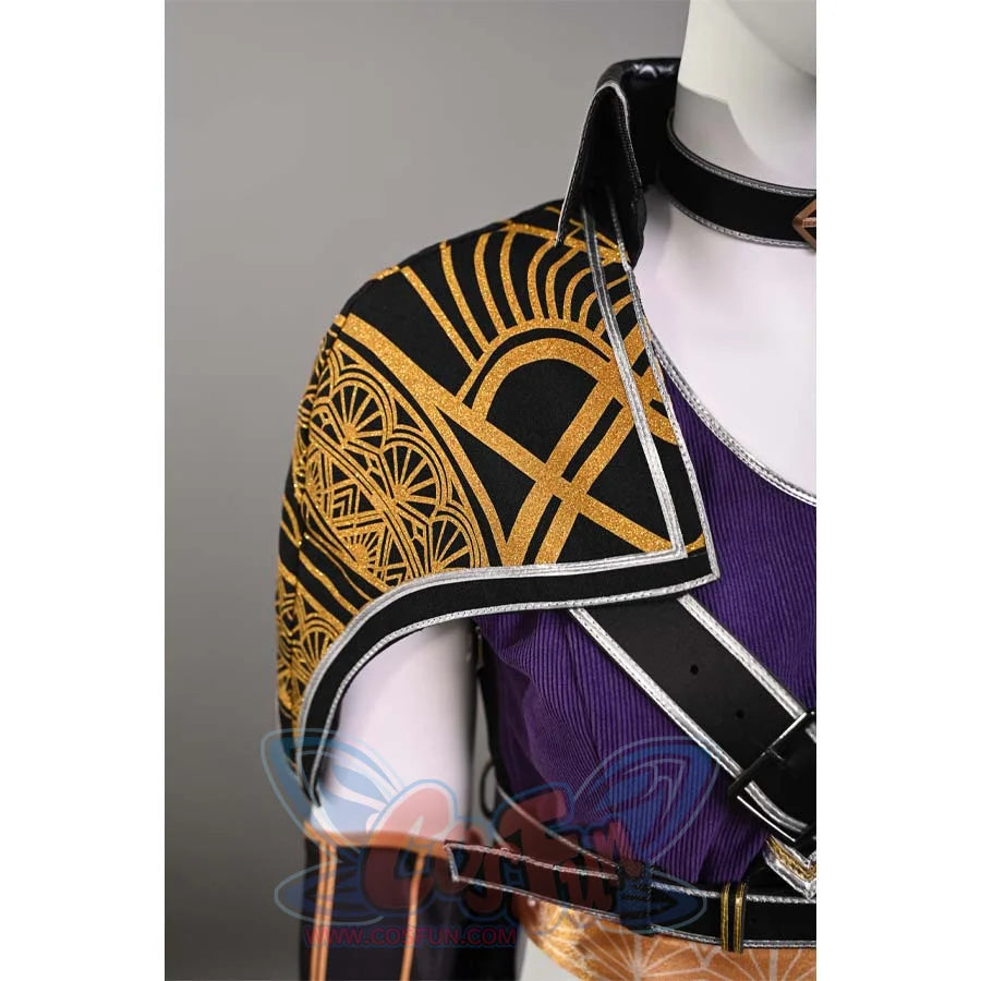 A close-up of the shoulder part of Sciel's cosplay costume, revealing the gold patterns and the detailed design on the black fabric.