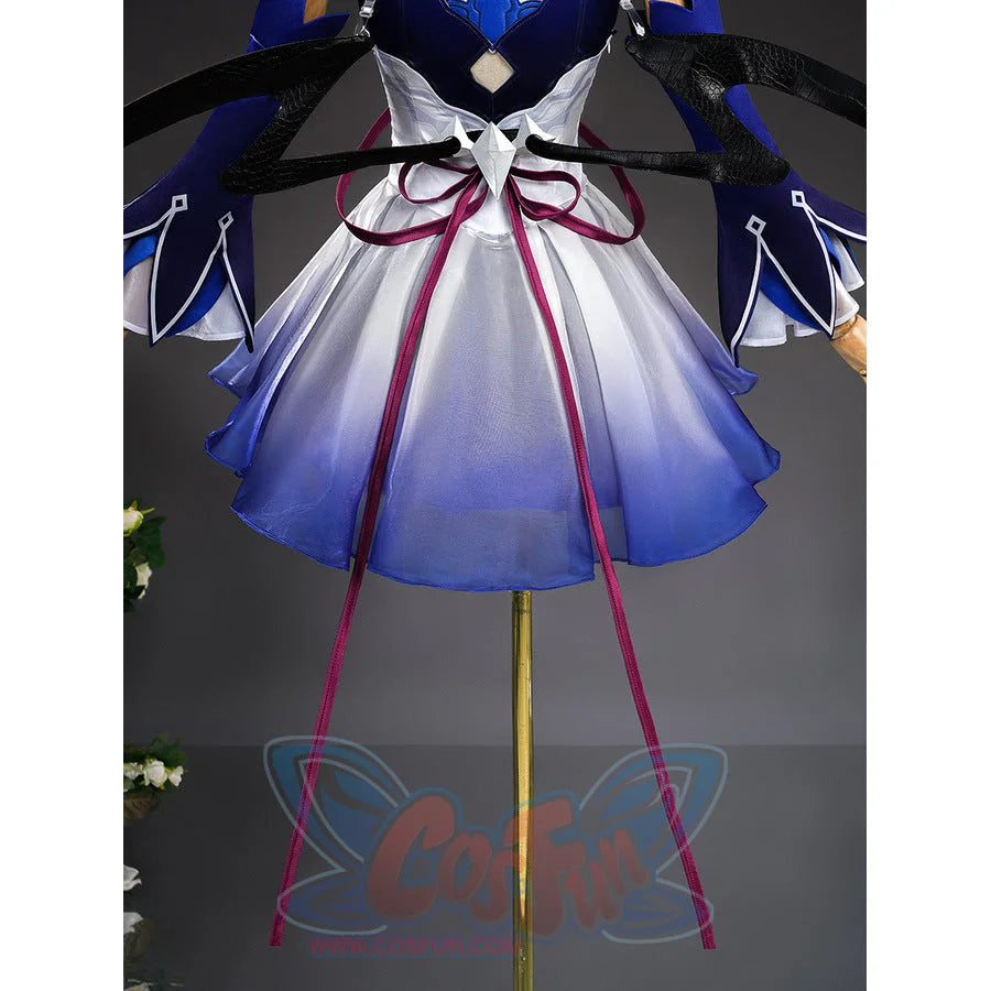 Seele cosplay lower body view showing blue gradient skirt with dark red ribbon and wing props