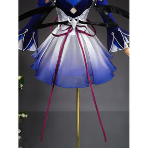 Seele cosplay lower body view showing blue gradient skirt with dark red ribbon and wing props