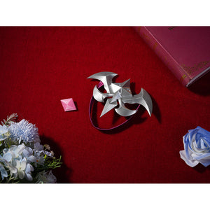 Seele cosplay silver shuriken star chest brooch accessory flat lay on red background with flowers