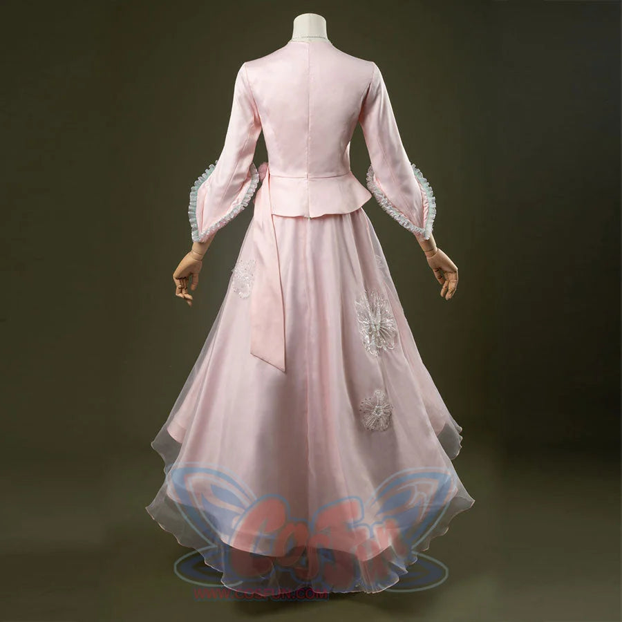 Glinda cosplay costume set featuring pastel pink vintage-inspired gown, ruffled lace cuffs, lace-trimmed sweetheart top, tulle overlay skirt, and necklace. Back side views.