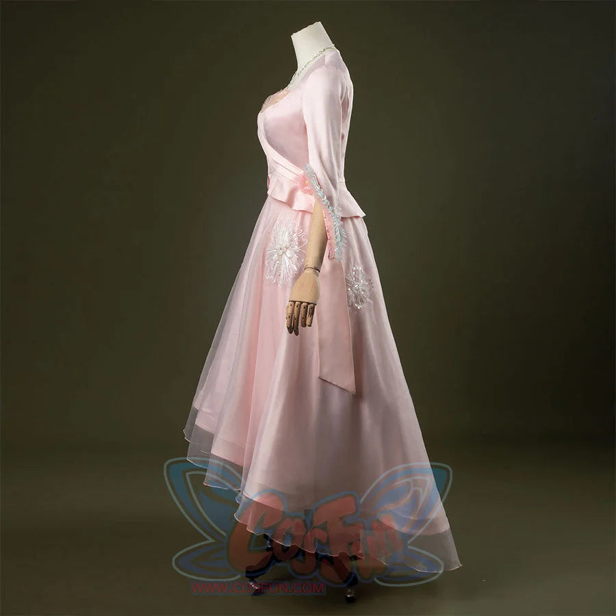 Glinda cosplay costume set featuring pastel pink vintage-inspired gown, ruffled lace cuffs, lace-trimmed sweetheart top, tulle overlay skirt, and necklace. Front and side views.