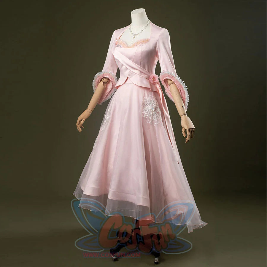 Glinda cosplay costume set featuring pastel pink vintage-inspired gown, ruffled lace cuffs, lace-trimmed sweetheart top, tulle overlay skirt, and necklace.