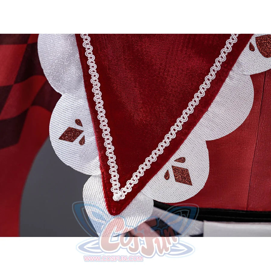 Sparxie cosplay costume red cape close-up with scalloped white lace hem, braided cord trim, and red diamond motifs