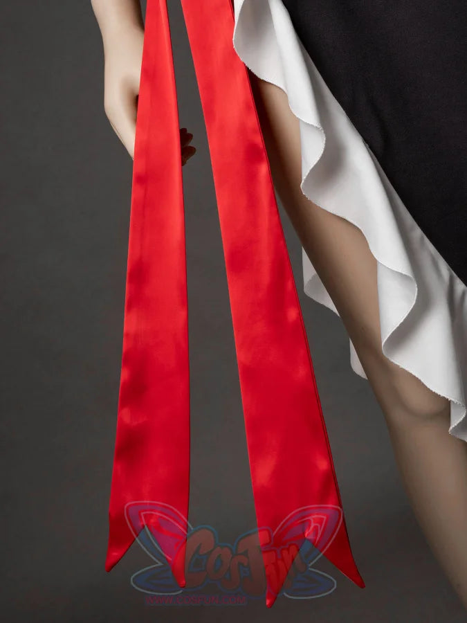 Starfire cosplay costume detail of long red satin sash ribbons hanging beside white ruffled skirt panels