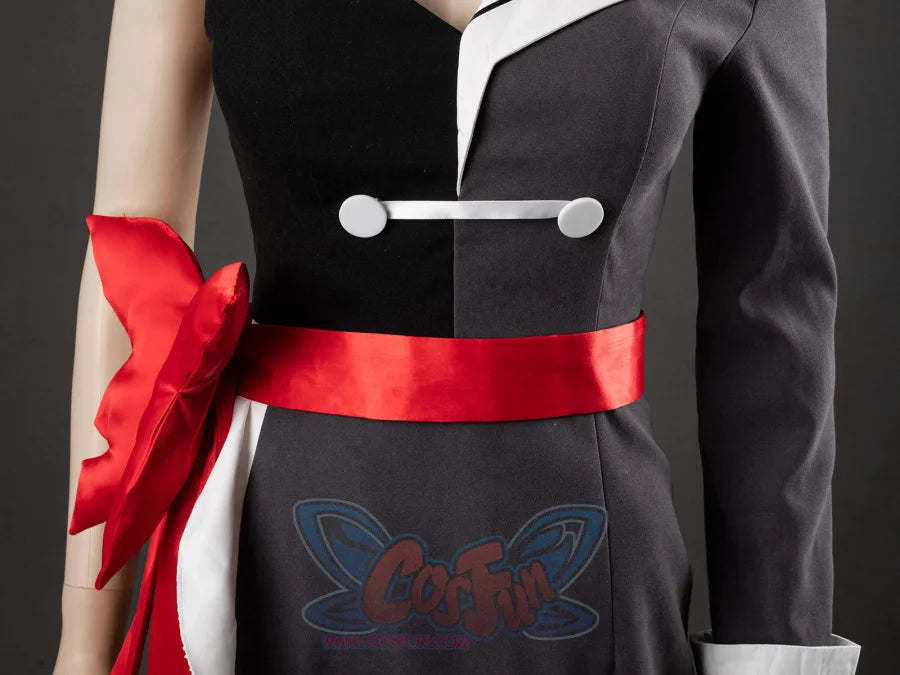 Starfire cosplay costume waist area detail, silver button bar clasp, wide red sash belt, and red bow with white ruffle