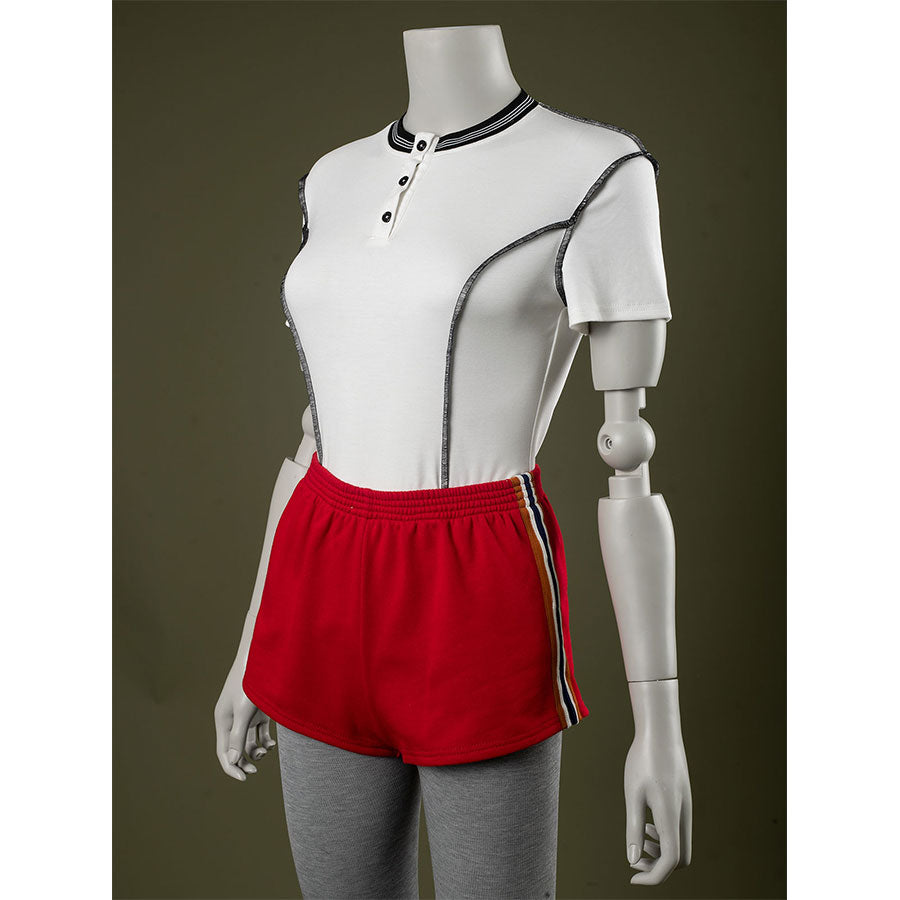 Side view: Eleven Cosplay Costume with T-shirt and red side-striped shorts.