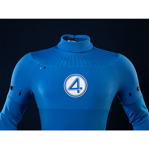 This close-up focuses on the upper body of the Reed Richards cosplay costume, highlighting the "4" emblem and the ribbed texture of the blue jumpsuit.