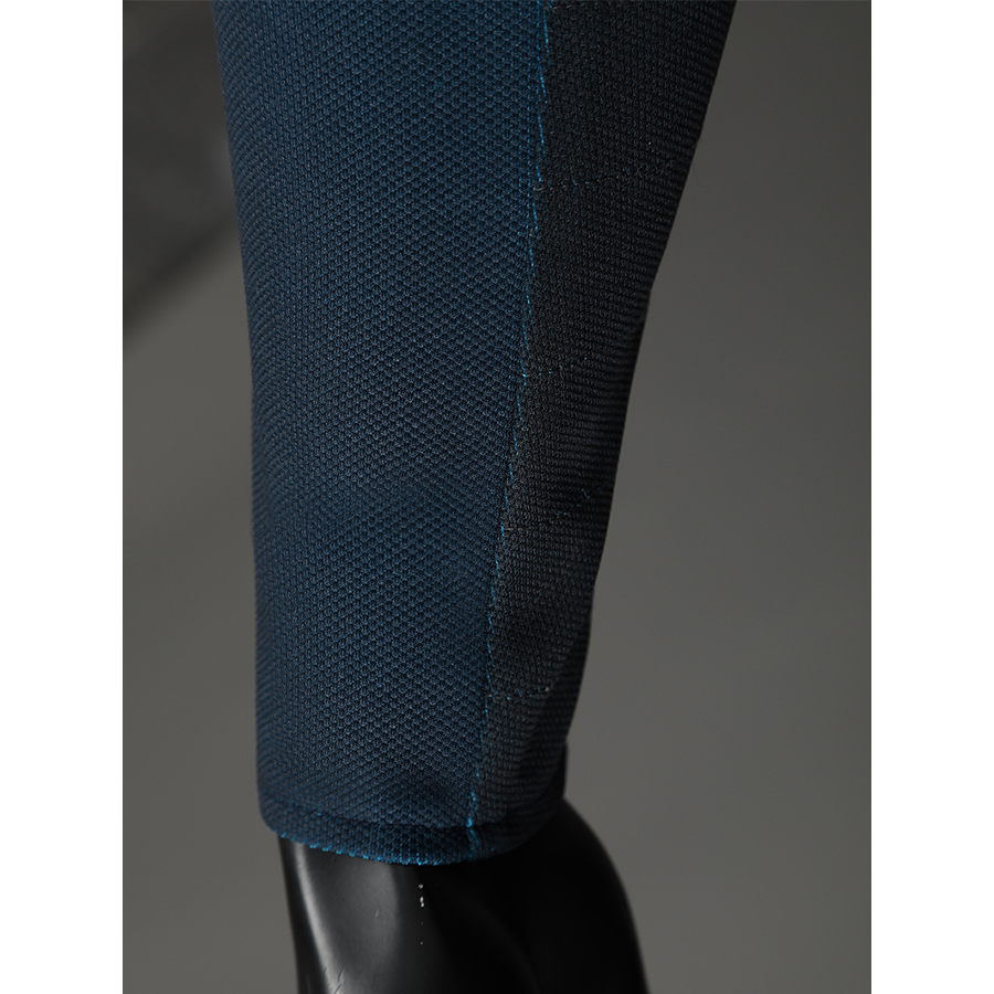The Fantastic Four cosplay suit pant texture detail showing blue fabric weave and black stitching