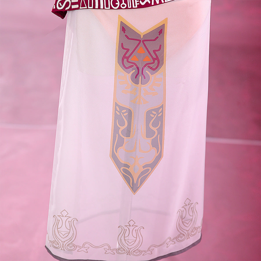 Close-up of the Princess Zelda cosplay sheer skirt featuring an ornate Zelda crest print in pink and purple with scrollwork hem detail.