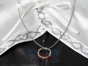 Undertaker cosplay nun costume accessory close-up of silver crown of thorns ring necklace, white embroidered collar