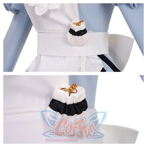 Close - up of a small white pouch with a black ruffle on the apron. It contains golden items, adding a cute and detailed accessory to the costume.