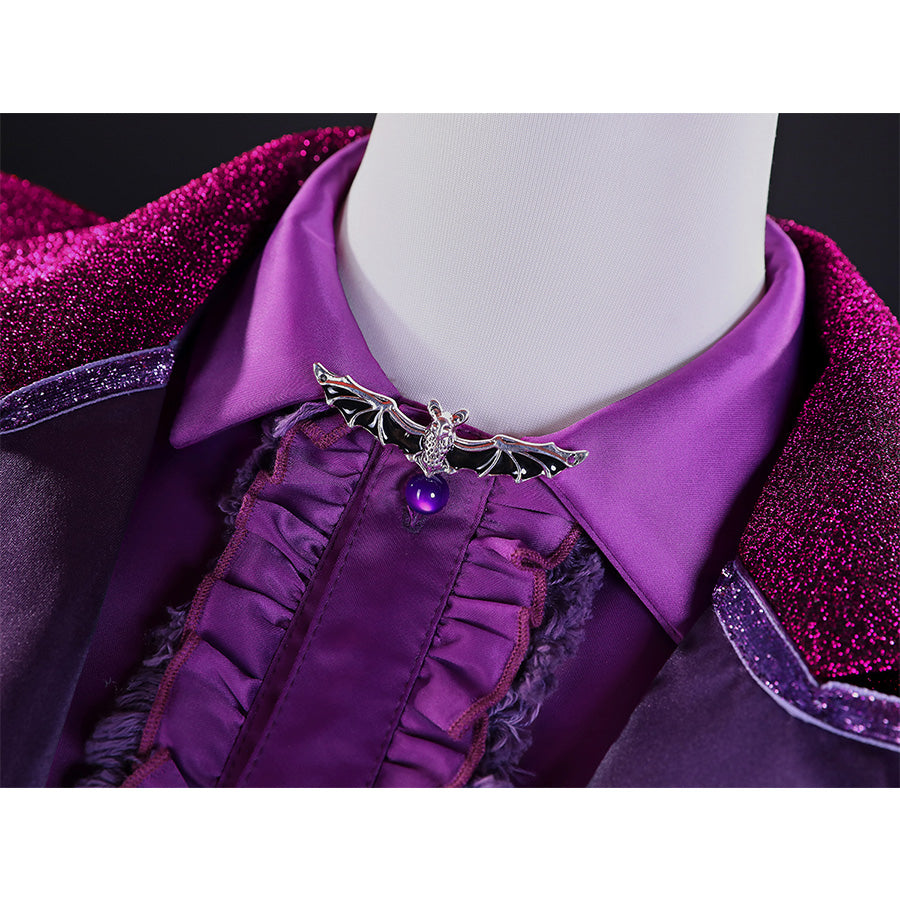 Detail of Vampire Vee Cosplay Costume silver bat  lapel pin with purple gem, ruffled shirt collar, and glitter fabric texture
