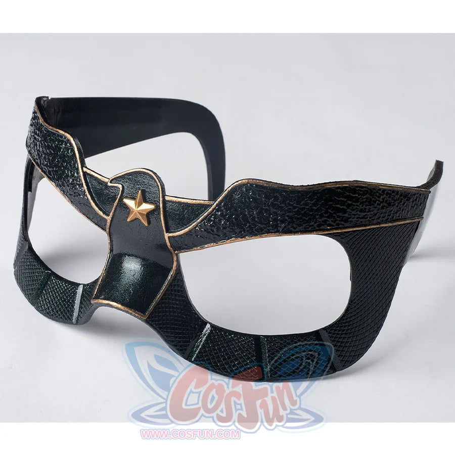 The mask is entirely black, adorned with golden bird-like lines and a star motif in the center.