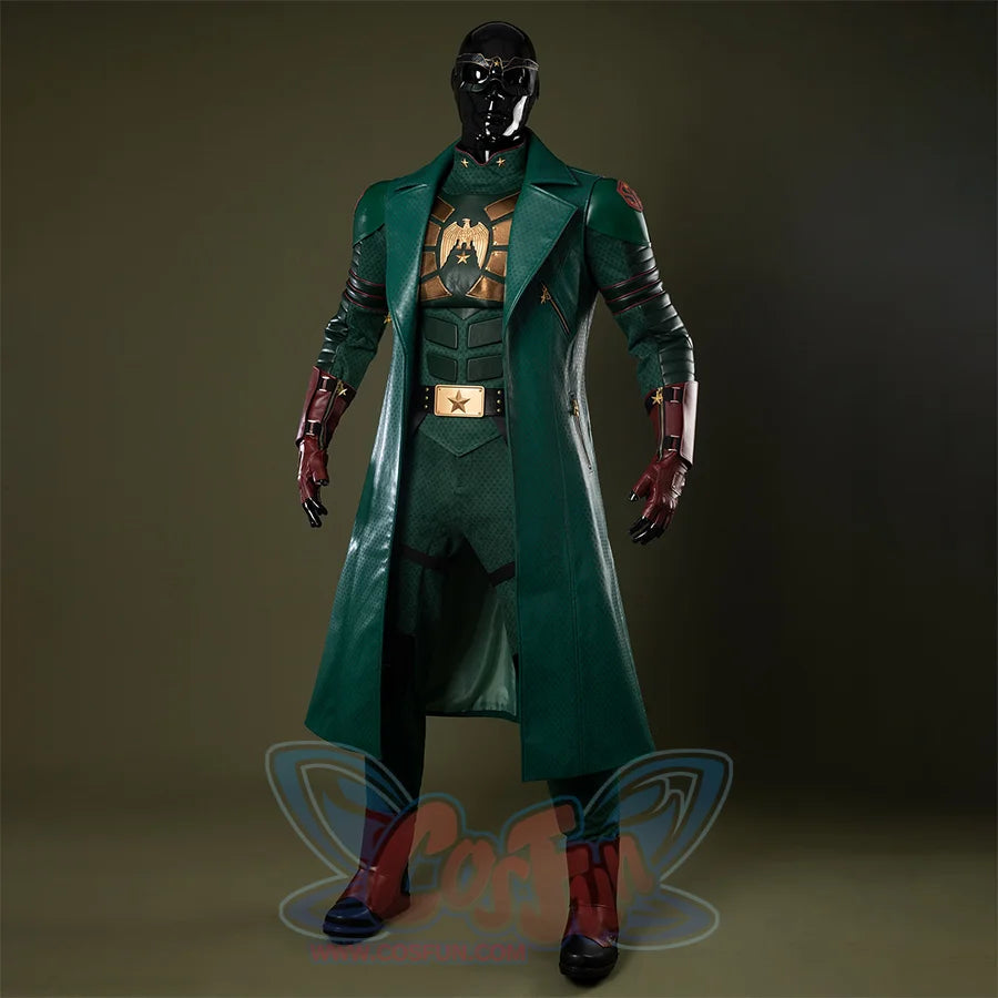 Costume mainly in dark green, accented with gold and reddish-brown tones, creating an overall sense of weight and solidity.