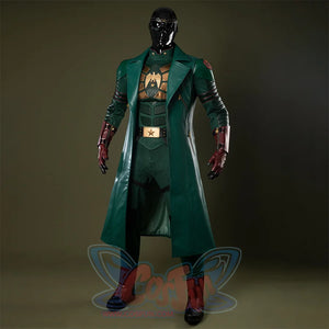 Costume mainly in dark green, accented with gold and reddish-brown tones, creating an overall sense of weight and solidity.