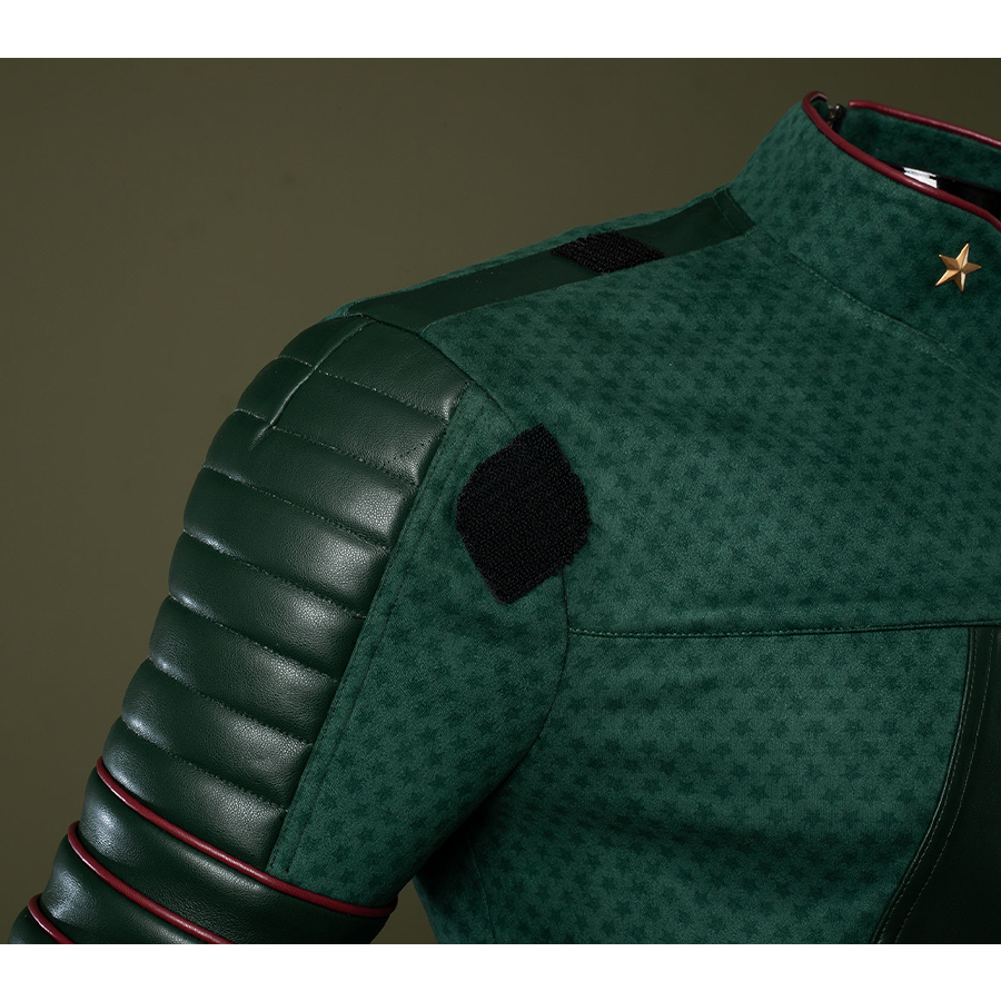 Dark green striped leather connects the shoulders to the arms, adding depth and dimension to the overall design.
