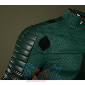 Dark green striped leather connects the shoulders to the arms, adding depth and dimension to the overall design.