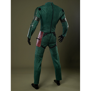 Form-fitting green suit made of textured material with intricate patterns.