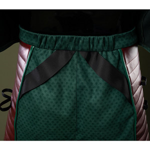 The back of the pants features an elastic waistband along with two black straps.
