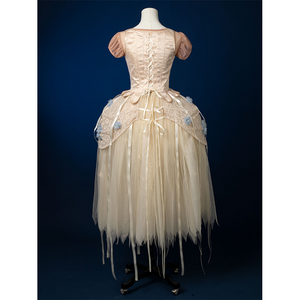 Enid Sinclair Gala dress back view with lace-up corset detail, cream tulle skirt, floral embroidery accents on waist