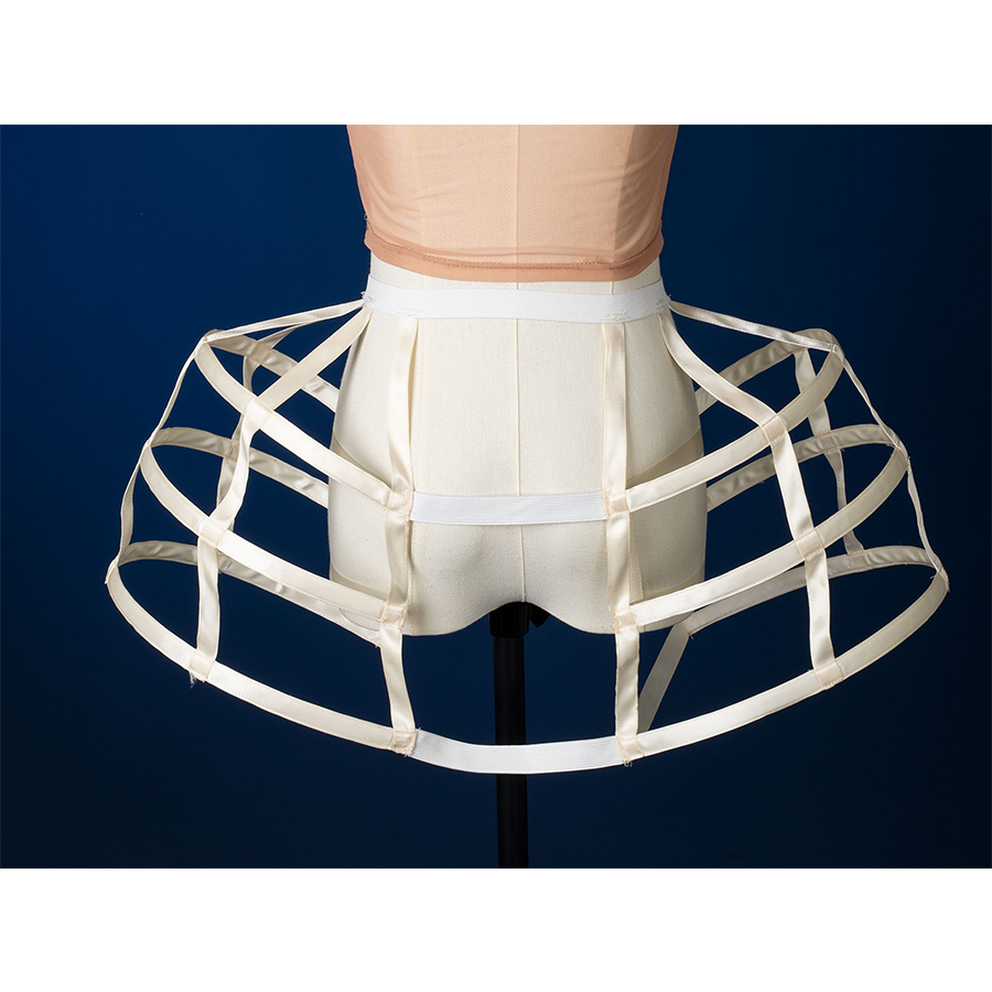 Enid Sinclair Gala dress hoop skirt back view with structured cage frame, cream ribbon waist ties, ball gown support system