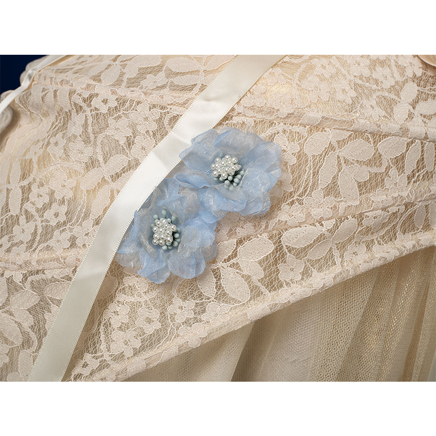 Enid Sinclair Gala dress skirt decoration with blue floral applique, pearl centers, cream lace, ribbon detail on tulle