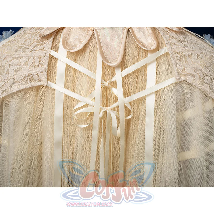 Enid Sinclair Gala dress side skirt detail with cream ribbon bows, lace-up corset back, layered tulle, blue floral accents