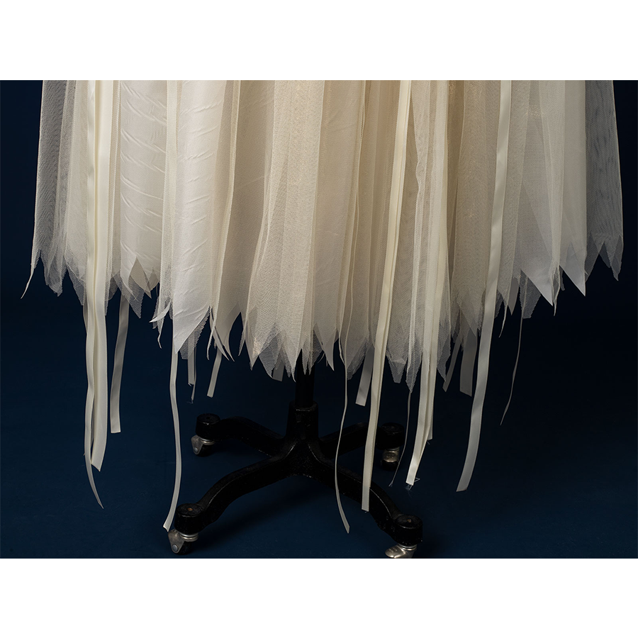 Enid Sinclair Gala dress skirt hem close-up with layered cream tulle, irregular edges, flowing ballet-style underskirt