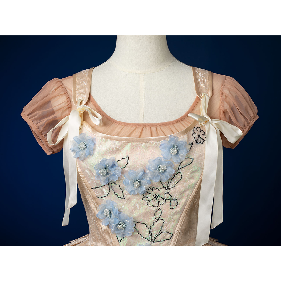 Enid Sinclair Gala dress vest bodice close-up with blue floral embroidery, satin fabric, pearl accents, puff sleeves