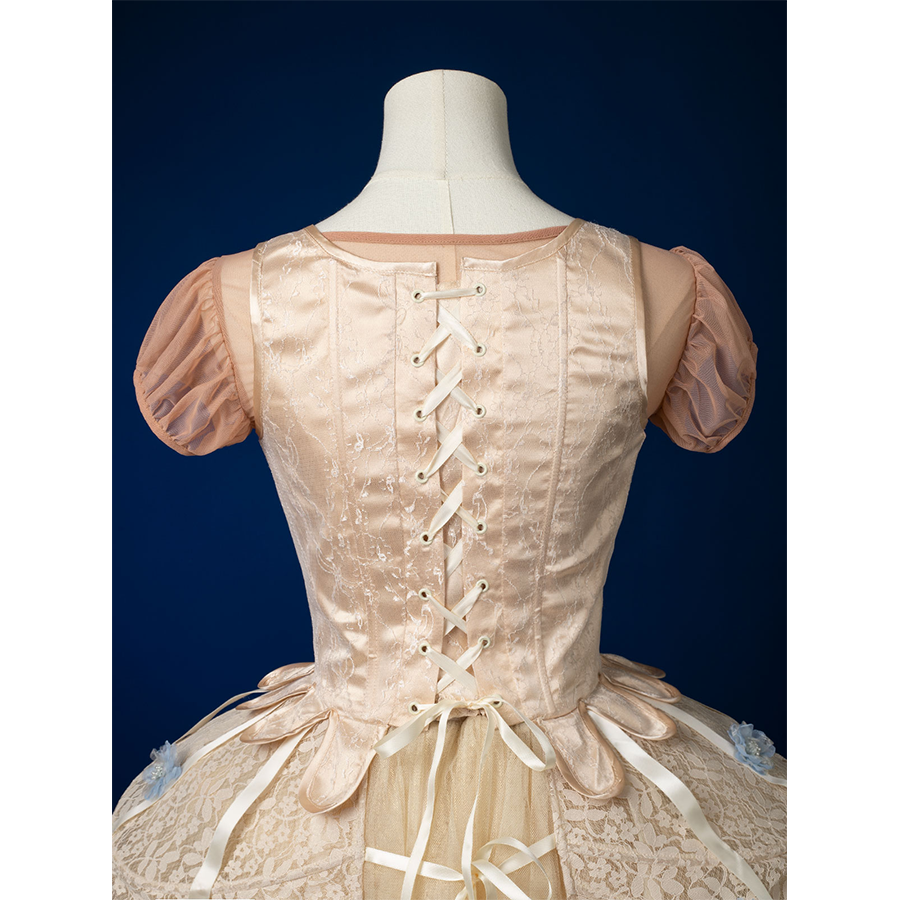 Enid Sinclair Gala dress vest back view with lace-up corset, cream ribbon ties, puff sleeves, layered tulle ball gown skirt
