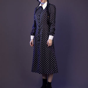 Wednesday cosplay navy dress with white collar and cuffs, front angle view with braided hair