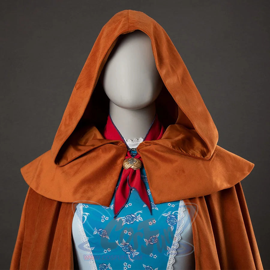 Holly cosplay yellow-brown hooded cloak close-up with red bow and blue floral dress visible underneath