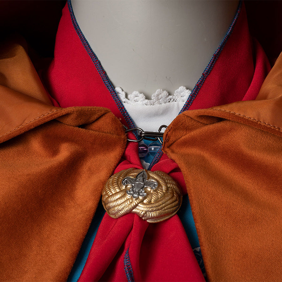 Holly cosplay costume red bow detail with gold floral brooch, yellow-brown cloak, white lace collar