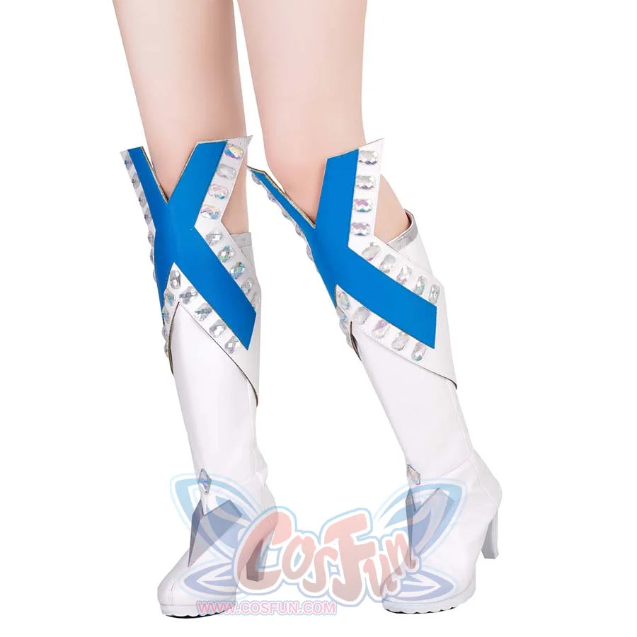 Close-up front display of Emma Frost cosplay boots, highlighting blue “X” straps, crystal accents, and silver geometric details on white high heels.