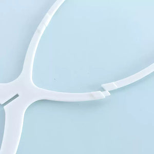 Close-up of white wig rack head connector joint detail