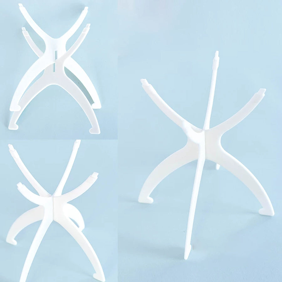 Close-up of white wig stand base components from multiple angles