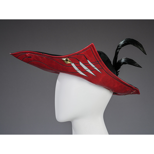 Cristoforo cosplay costume cap side view with red triangular design, silver teeth, black feathers, gold emblem accent