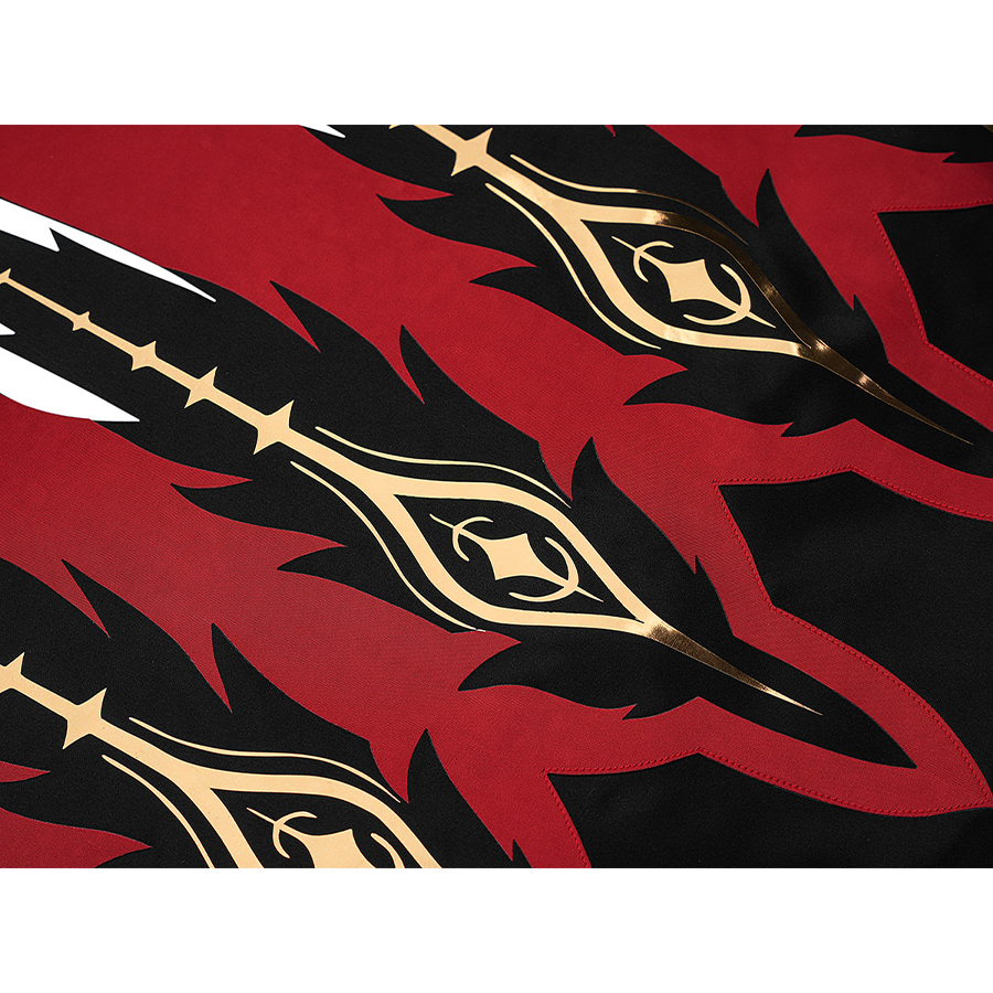 Cristoforo cosplay costume cloak hem detail closeup with gold ornate symbols on black, red flame edges, intricate pattern