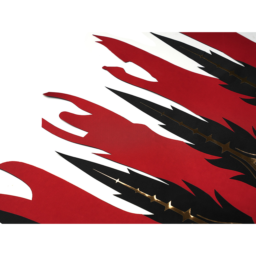 Cristoforo cosplay costume irregular hem with red black asymmetric flame cuts, white accents, gold stud details closeup