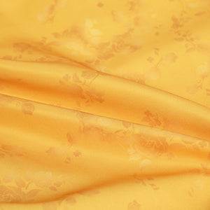 Judy yellow floral dress fabric close-up showing floral print pattern and texture