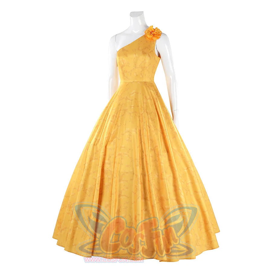 Judy yellow floral dress side angle showing flower accent and flowing pleated design