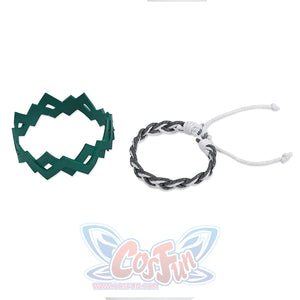 There are a green geometric bracelet with an irregular angular design, and a bracelet woven from black and white ropes.